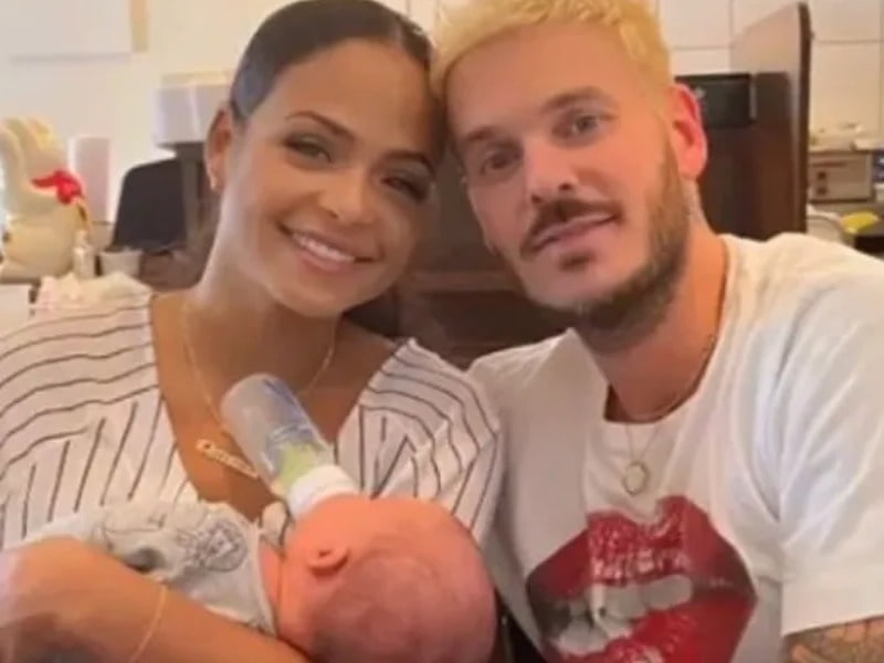 Kenna Tota's father Matt Pakora and his mother Christina Milan feeding Tota.  